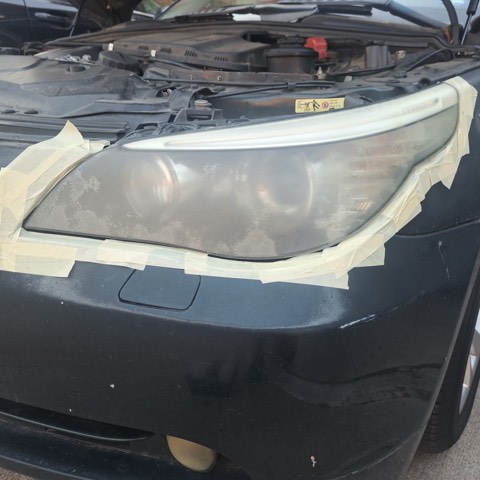 Sedan headlight before restoration, hazy and oxidized
