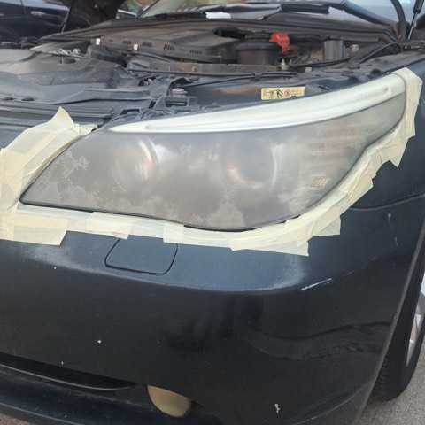 Sedan headlight before restoration, hazy and oxidized