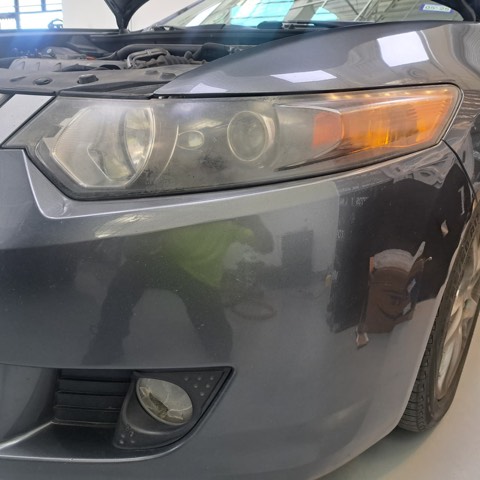 Sedan headlight before restoration, hazy and oxidized