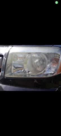 Sedan headlight before restoration, hazy and oxidized