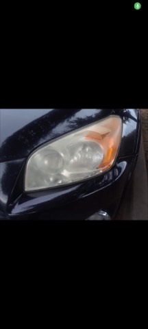 Sedan headlight before restoration, hazy and oxidized