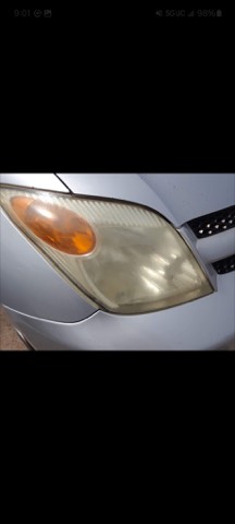 Sedan headlight before restoration, hazy and oxidized